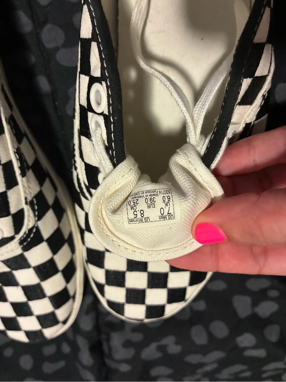 Vans Black and White Checkerboard Slip-On Sneakers